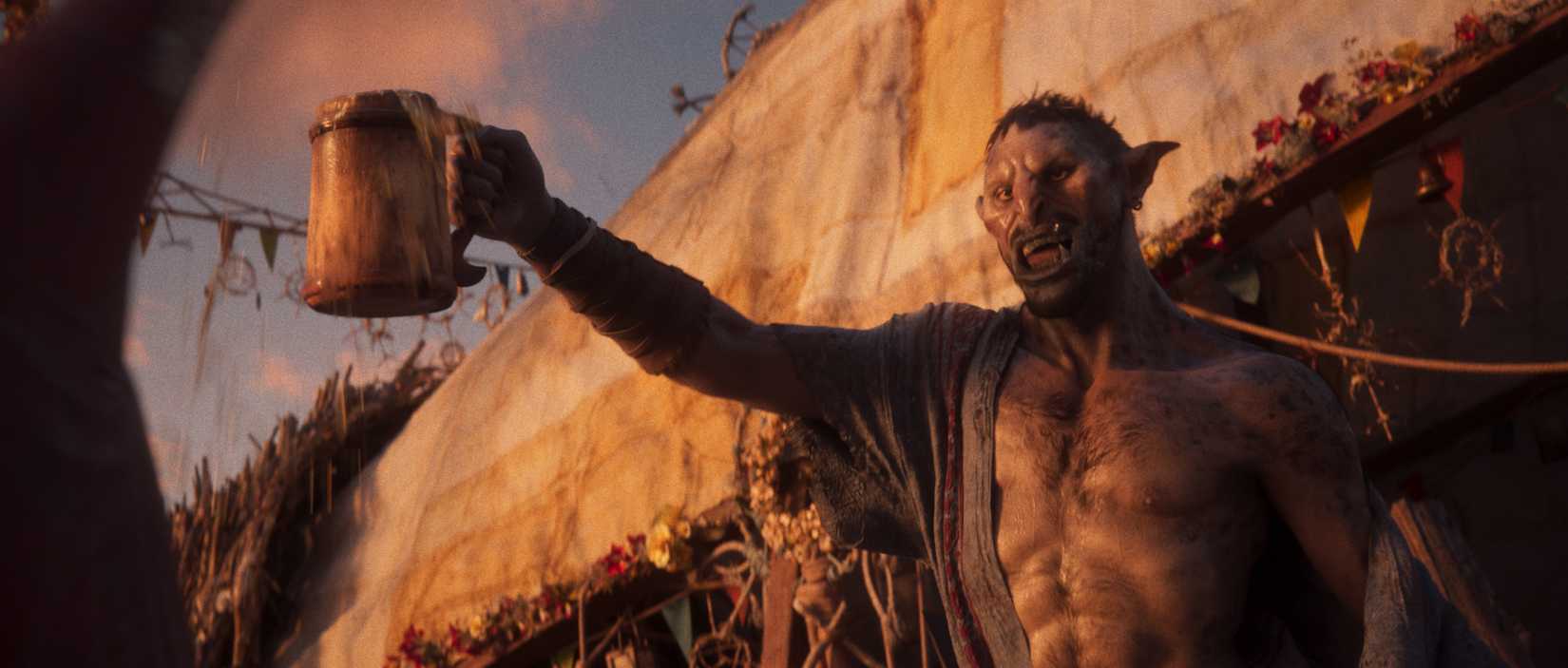 Ein Screenshot von Divinity, der einen Ork zeigt, der einen Krug Bier hebt